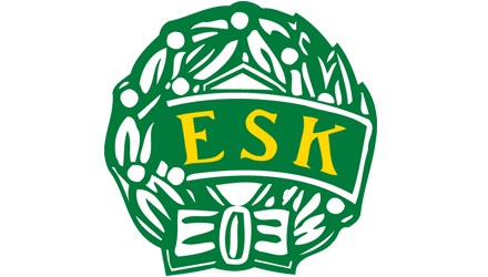 logo för fotbollsklubben ESK, Enköpings sportklubb. Grön stiliserad krans med löv och ett grönt band i mitten med gula versala bokstäverna ESK.